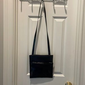 Cleo and Patek black leather bag